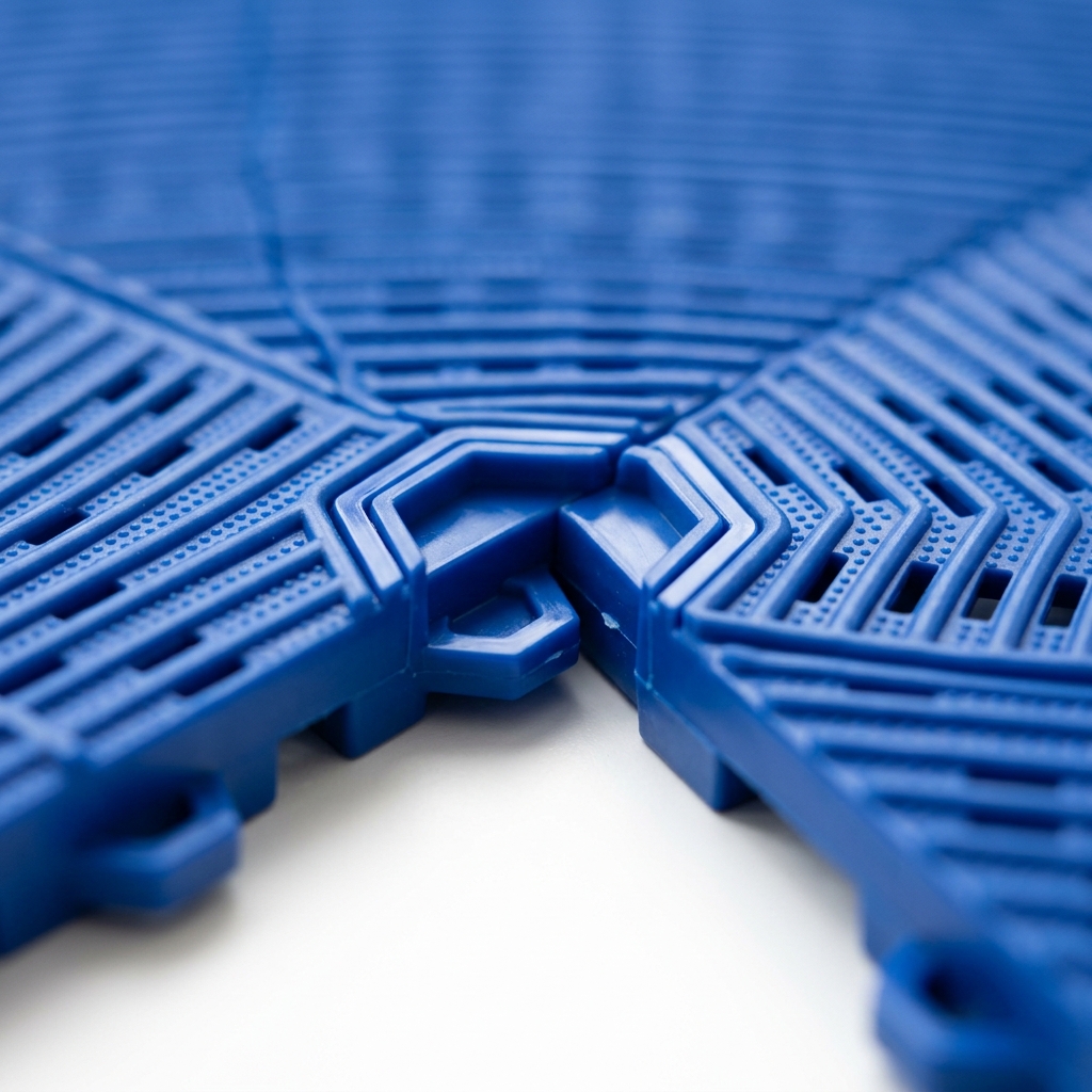 Close-up of PP interlocking modular tile surface texture showing anti-slip ribbing and click-lock connector